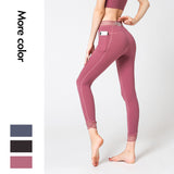 Beautiful waist stitching yoga pants with pockets high-waist elastic beam feet nine-point running fitness pants