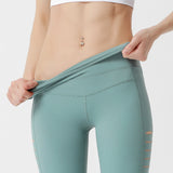 Sports hip-lifting yoga pants side hollow hip-lifting fitness running pants