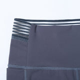 Beautiful waist stitching yoga pants with pockets high-waist elastic beam feet nine-point running fitness pants