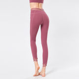 Beautiful waist stitching yoga pants with pockets high-waist elastic beam feet nine-point running fitness pants