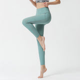 Nylon nude side pocket yoga pants hollow stitching hip-lifting tight-fitting sports running fitness pants