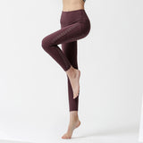 Nylon nude side pocket yoga pants hollow stitching hip-lifting tight-fitting sports running fitness pants